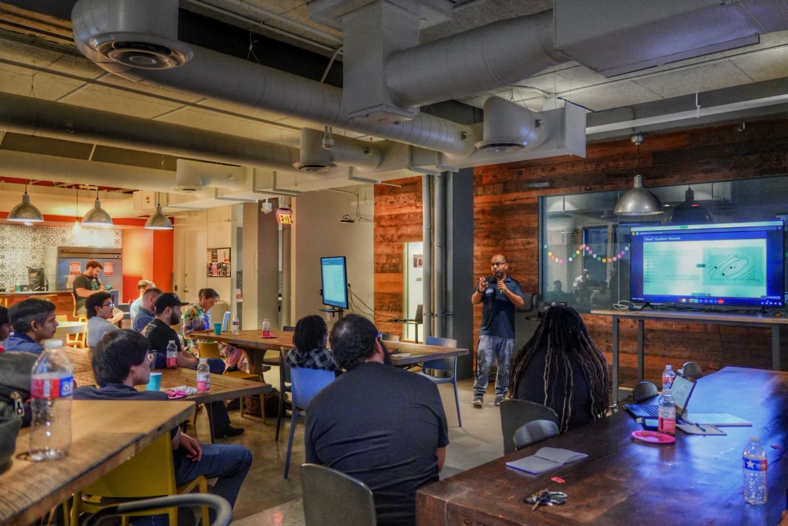 A speaker presenting a slide to the room at PySanAntonio 2025